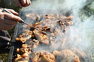 Meat on the grill. Chef cooking grilling mix of fresh grilled chicken meat