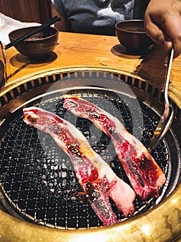 Meat grill with spoon and fire