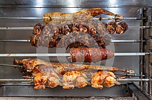 Meat grilling, chicken, pork, bacon on a grill skewers