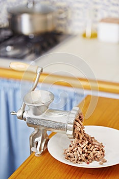Meat grinder in domestic kitchen
