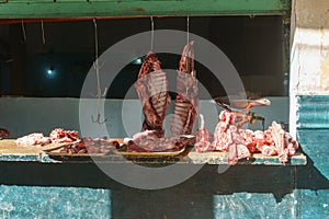 Meat hung in a butcher`s shop