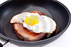 Meat loaf and fried egg in a skillet