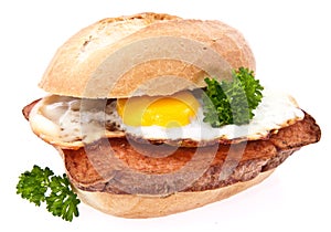 Meat loaf on a roll with fried egg