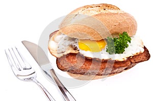 Meat loaf on a roll with fried egg