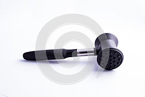 Meat mallet or tenderizer; black plastic and metal; isolated on