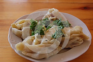 Meat manti with a parsley