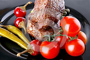 Meat medallion with cherry tomatoes