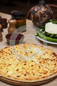 Meat ossetian pie on a table