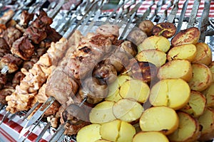 Meat and patato kebabs on skewers photo