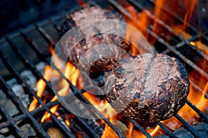 Meat Patties on Flaming Grill photo