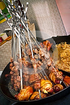 Meat pieces on spits