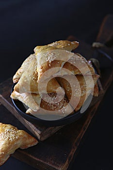 Meat pies. Meat pies on a wooden board. Puff pastry. Homemade food.