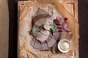 Meat platter - prosciutto ham, beef, beef tongue. With rye croutons.