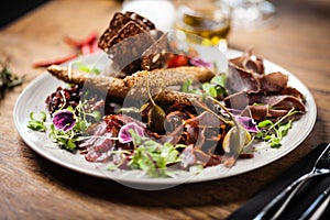 Meat platter for two served on a plate in restaurant