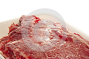 Meat in polystyrene bowl