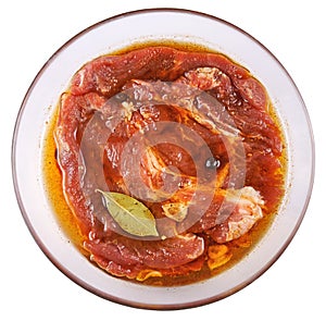 Meat, Pork in marinade on a glass plate