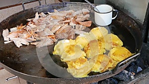 Meat and potatoes pies ready on the street