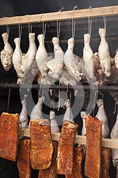 Meat prepared for smoking. Raw meat in a smokehouse.