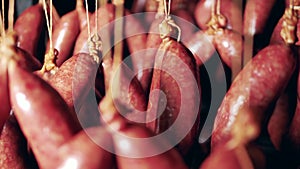 Meat-preserving unit with hanging smoked sausages