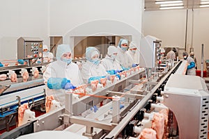 Meat processing plant.Industrial equipment at a meat factory.Modern poultry processing plant.People working at a chicken