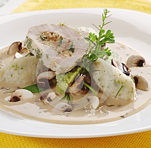 Meat roll with potato dumplings and mushroom sa