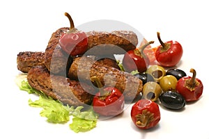 Meat rolls with olives and pepper