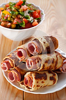 Meat rolls in the omelet, vegetable