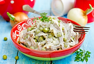 Meat salad with canned green peas and onion