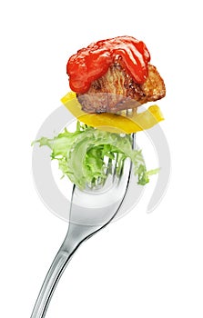 Meat and salad on a fork photo