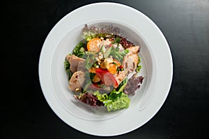 Meat salad with greens and eggs