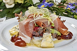 Meat salad with ham cheese lettuce Dorblu grapes and olive oil