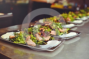 Meat salad in the restaurant kitchen, the dish is ready for serving to the client