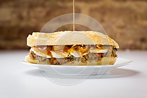 Meat sandwich with sweet onion and goat cheese