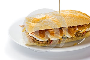 Meat sandwich with sweet onion and goat cheese. Venezuelan food