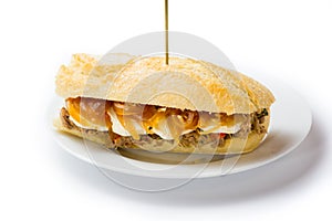 Meat sandwich with sweet onion and goat cheese. Venezuelan food