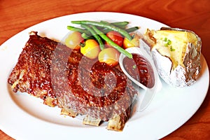 Meat savory on table : roast shoulder with tomato and chives over white plate