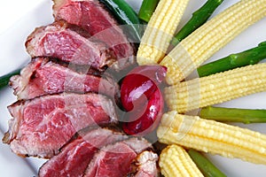 Meat served on white with corns