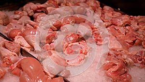 Meat shop. A wide selection of meat products in the supermarket. Fresh meat in a showcase. Fresh raw meat in a showcase.