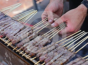Arrosticini are a class of traditional dishes of skewered grilled meat typical of Abbruzzo and Molise regions in Italy photo