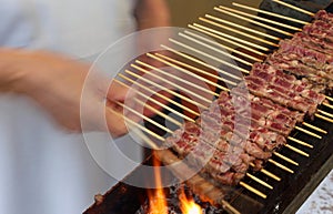 meat skewers of lamb cooked on the grill