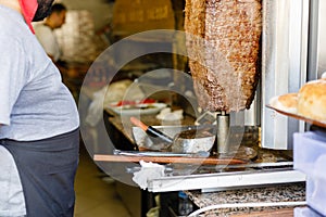 meat on a spit which is prepared for shawarma