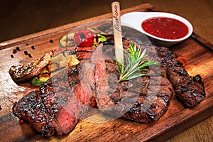 Meat steak on the wooden board