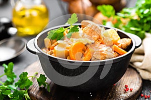 Meat stew with vegetables. Braised meat with cabbage, carrot and potato