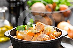 Meat stew with vegetables. Braised meat with cabbage, carrot and potato