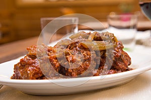 Coda alla vaccinara meat tail dish specialty from lazio region and Roma area called coda alla vaccinara photo