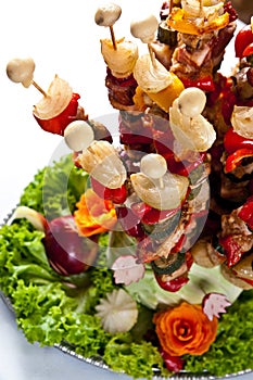 Meat and vegetable appetizers on skewers