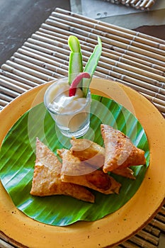 Meat and vegetable samosas in a small restaurant