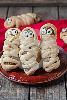 Meatball sausage mummies wrapped with dough. Scary