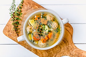 Meatball soup with fresh herbs