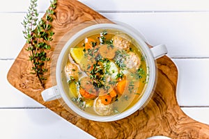 Meatball soup with fresh herbs